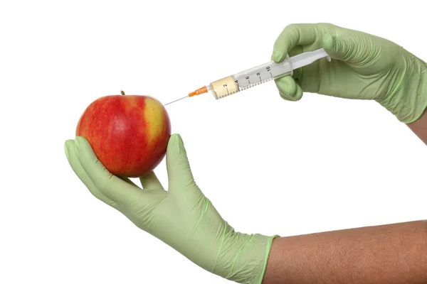 Agricultural concept, apple and syringe — Stock Photo, Image