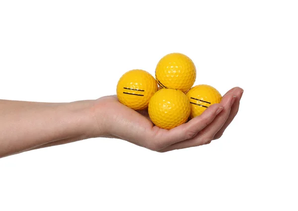 Bolas de golfe na mão sobre fundo branco — Fotografia de Stock