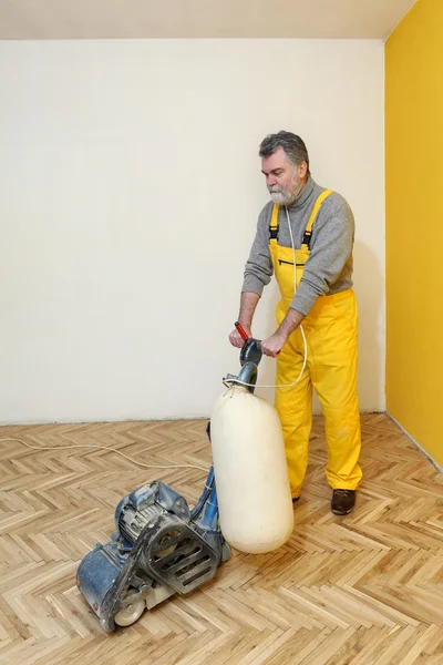 Casa renovação, lixamento em parquet Fotografia De Stock