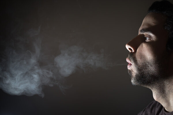 Profile of a person smoking