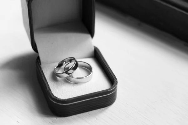 Pair of Wedding Rings in the Wood Box in the Wedding Ceremony Day.