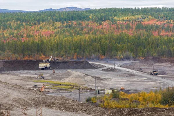 Autumn, 2016 - Magadan, Russia - Construction of the Ust-Srednekanskaya hydroelectric station. Sand quarry for the extraction of soil for filling the river dam