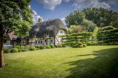 English Village Thatched Cottage and garden clipart
