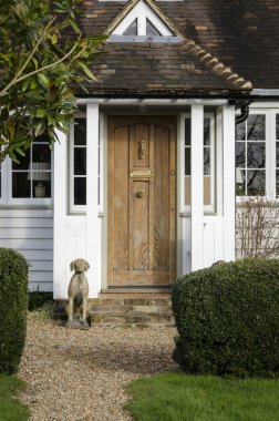 Cottage door and Dog Statue clipart