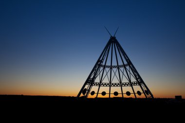 Medicine Hat Teepee at Sunset clipart