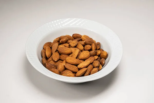 a bowl with a bowl of almonds