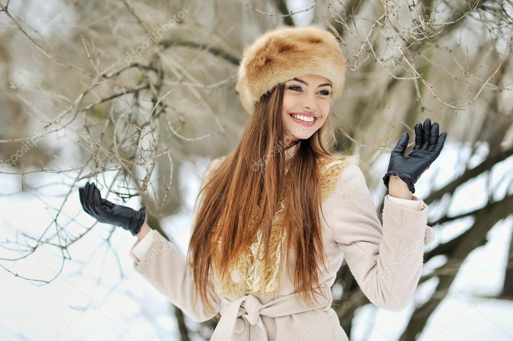 Beautiful smiling winter girl - outdoor portrait