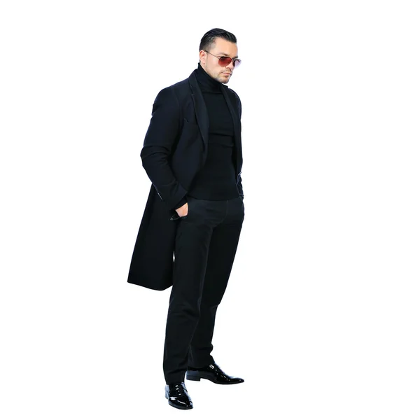 Full length portrait sexy man in black coat isolated on white — Stock Photo, Image