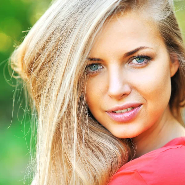 Beautiful young woman face closeup Stock Image