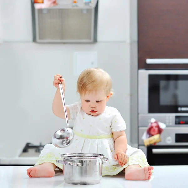 Little girl cooking on a kitchen — Stock Photo, Image