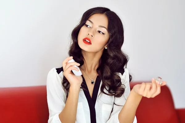 Girl with perfume, young beautiful woman holding bottle of perfu — Stock Photo, Image