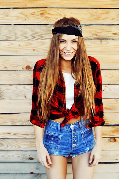 Beautiful smiling hipster woman outdoor 