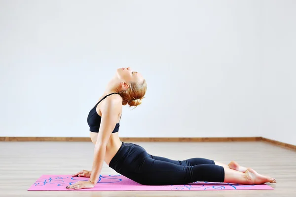 Woman in the cobra yoga pose — Stock Photo, Image