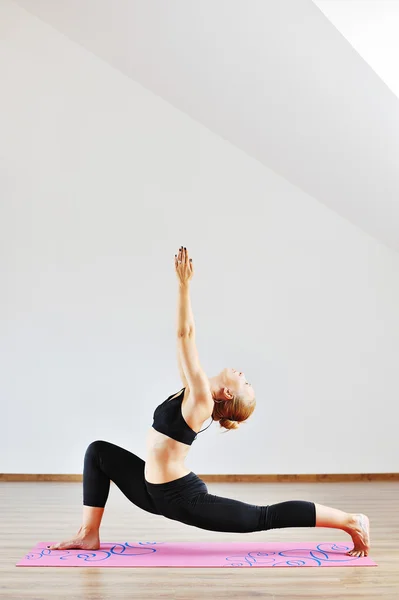 Young woman in yoga pose — Stock Photo, Image