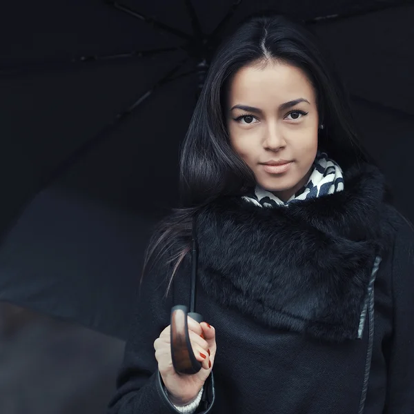 Young woman under umbrella - close up — Stock Photo, Image