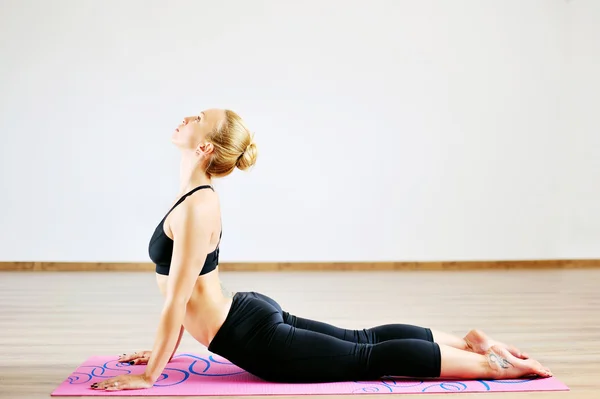 Woman in the cobra yoga pose — Stock Photo, Image