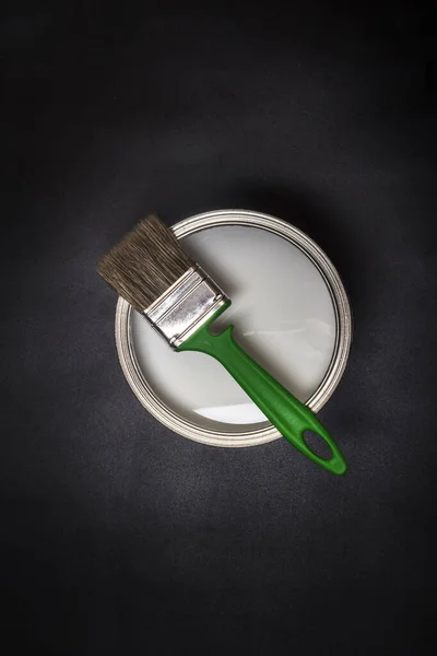 Flat Lay Green Brush Iron Can Paint Black Textured Background — стоковое фото