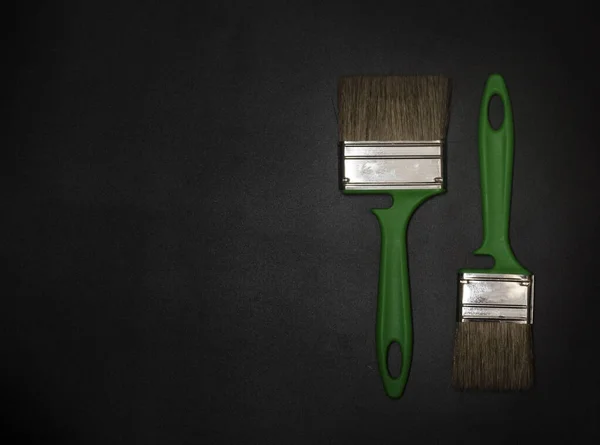 Two Green Brushes Black Background Copy Space — Stock Photo, Image