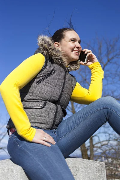 Pretty girl sneezing outdoors — Stock Photo, Image