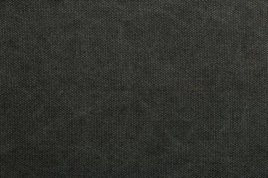 Çekim koyu renkli desenli bir kumaş parçasını gösteriyor. Işık boşluğu dolduruyor, kumaşın detaylarını vurguluyor. Bu ayar kapalı gibi görünüyor..