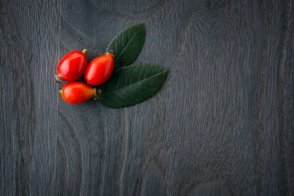 Rozebottels boven hout — Stockfoto