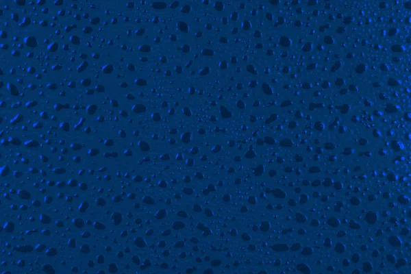 Blauwe waterdruppels achtergrond. — Stockfoto