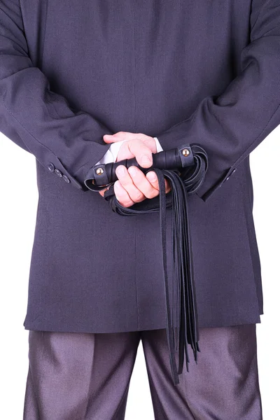 Businessman holding a leather whip. — Stock Photo, Image