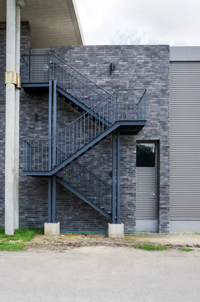 Fire escape staircase on the brick wall — Stock Photo, Image