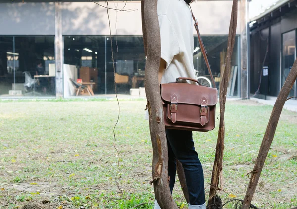 Woman with vintage leather bag — Stock Photo, Image