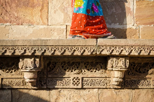 Indian woman walking on beautiful border patterns & designs engr — Stock Photo, Image