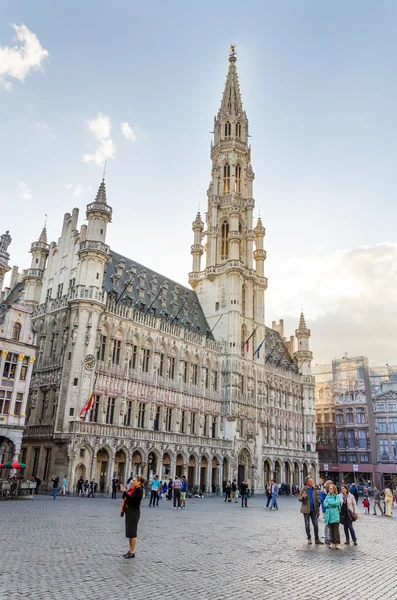 Brussels, Belgium - May 13, 2015: Many tourists visiting famous Grand Place of Brussels.