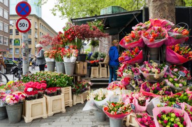 Rotterdam, Netherlands - May 9, 2015: People at Flower shop in Rotterdam