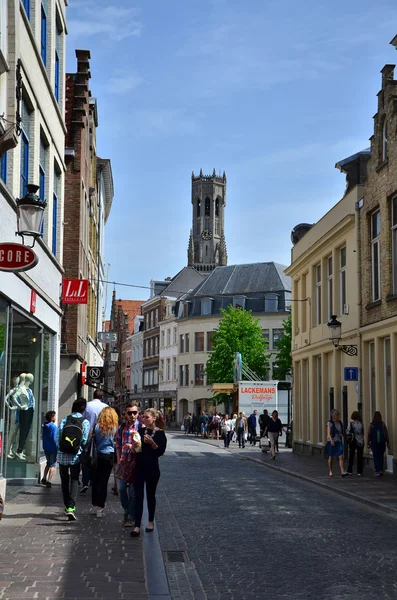 Bruges, Belgium - May 11, 2015: Tourists visit Steenstraat Shopping Street in Bruges, Belgium. — Stockfoto