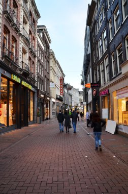Amsterdam, Netherlands - May 7, 2015: Unidentified people Shopping on Kalverstraat, main shopping street of Amsterdam.