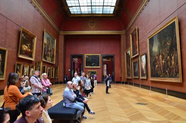 Paris, France - May 13, 2015: Visitors visit Rubens paintings in Louvre Museum clipart