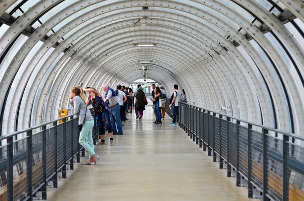 Paris, France - May 13, 2015: People visit Glass tube corridor at Pompidou Centre — Stock Fotó