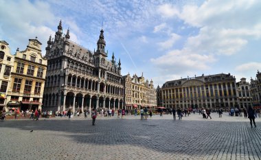 Brussels, Belgium - May 13, 2015: Tourists visiting famous Grand Place of Brussels.