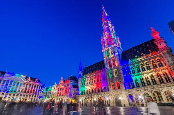 Brussels, Belgium - May 13, 2015: Tourists visiting famous Grand Place (Grote Markt) the central square of Brussels.