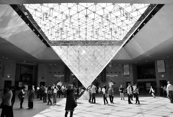 Paris, France - May 13, 2015: Tourists visit Inside the Louvres pyramid — Stock Photo, Image