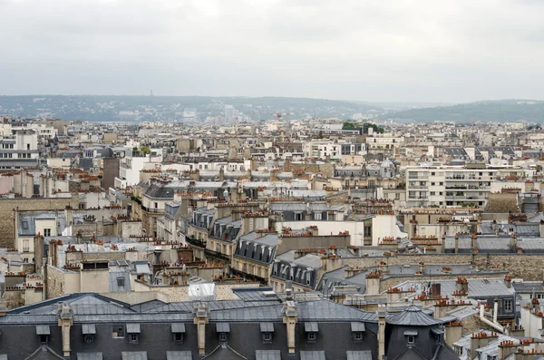 Roofs of Paris with moody sky — Stock Photo, Image