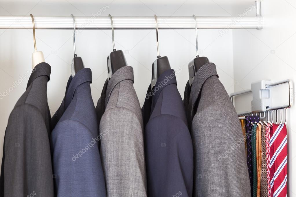 Suits and ties in wardrobe