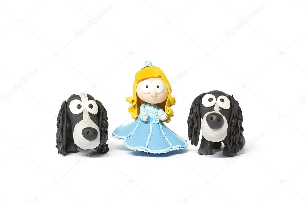 Toy doll with dogs on white