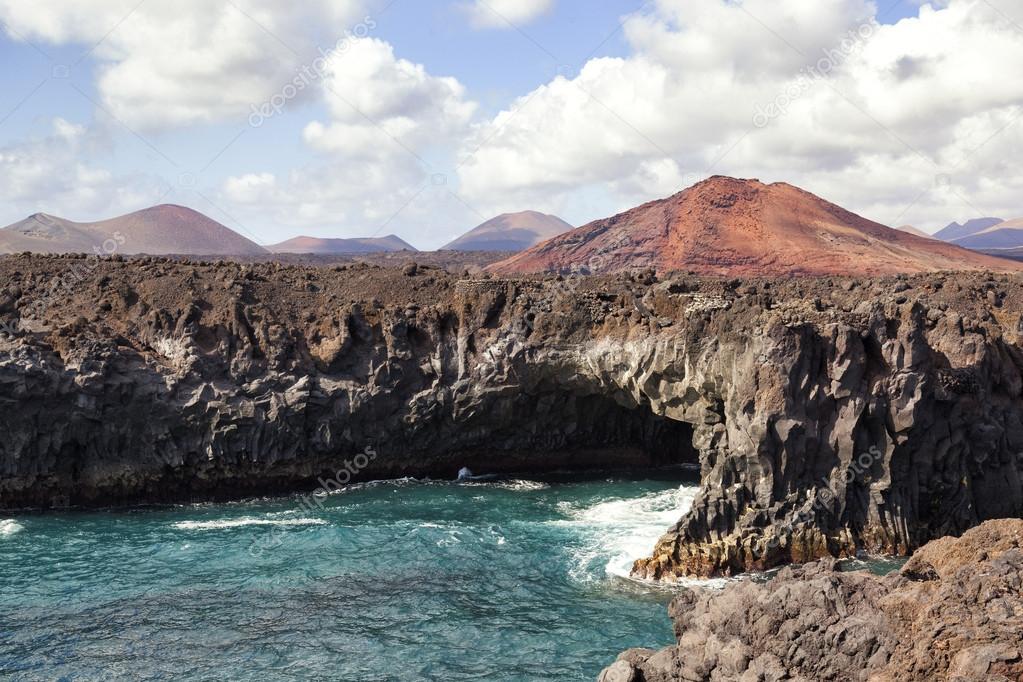 Shoreline cave and volcano