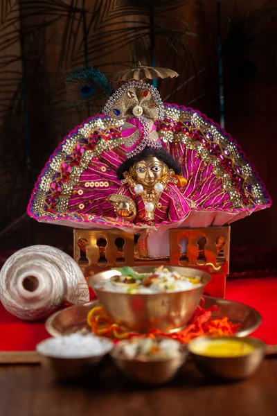 Close-up of indian home tample during the birthday celebration of Lord Krishna ( Janmashtami ) with puja thali and kheer ( khir ) as prashad.