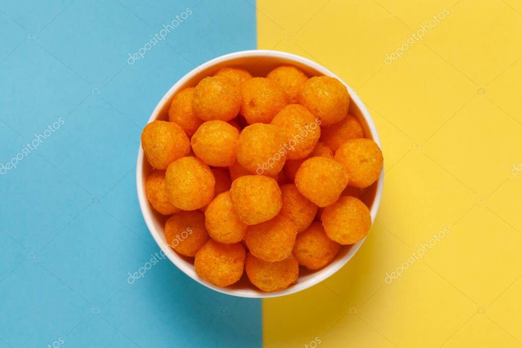 Close up of Cheese Potato Puff Ball Snacks, color naranja picante