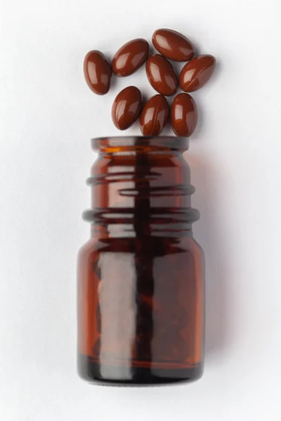 Macro Primer Plano Píldora Medicinal Herbal Color Rojo Oscuro Marrón —  Fotos de Stock