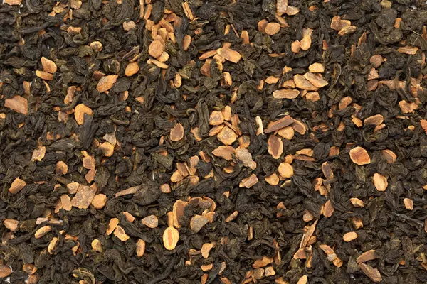 Organic Cinnamon green tea. Macro closeup background texture. Top view.
