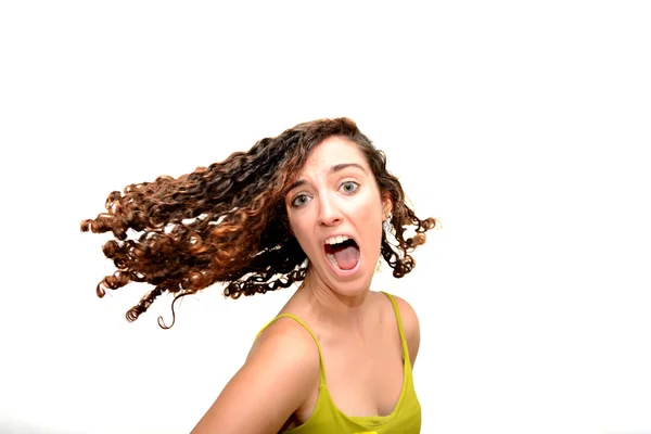 Beauty Woman screaming  with her hair in motion Portrait over Wh Stock Photo