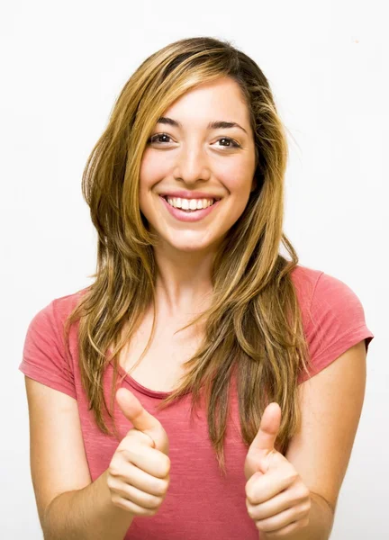 Portrait of a beautiful woman with her thumb up in sign of optim — Stock Photo, Image