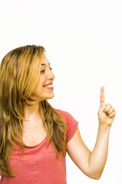 Portrait of a beautiful woman pointing up with her finger — Stock Photo, Image